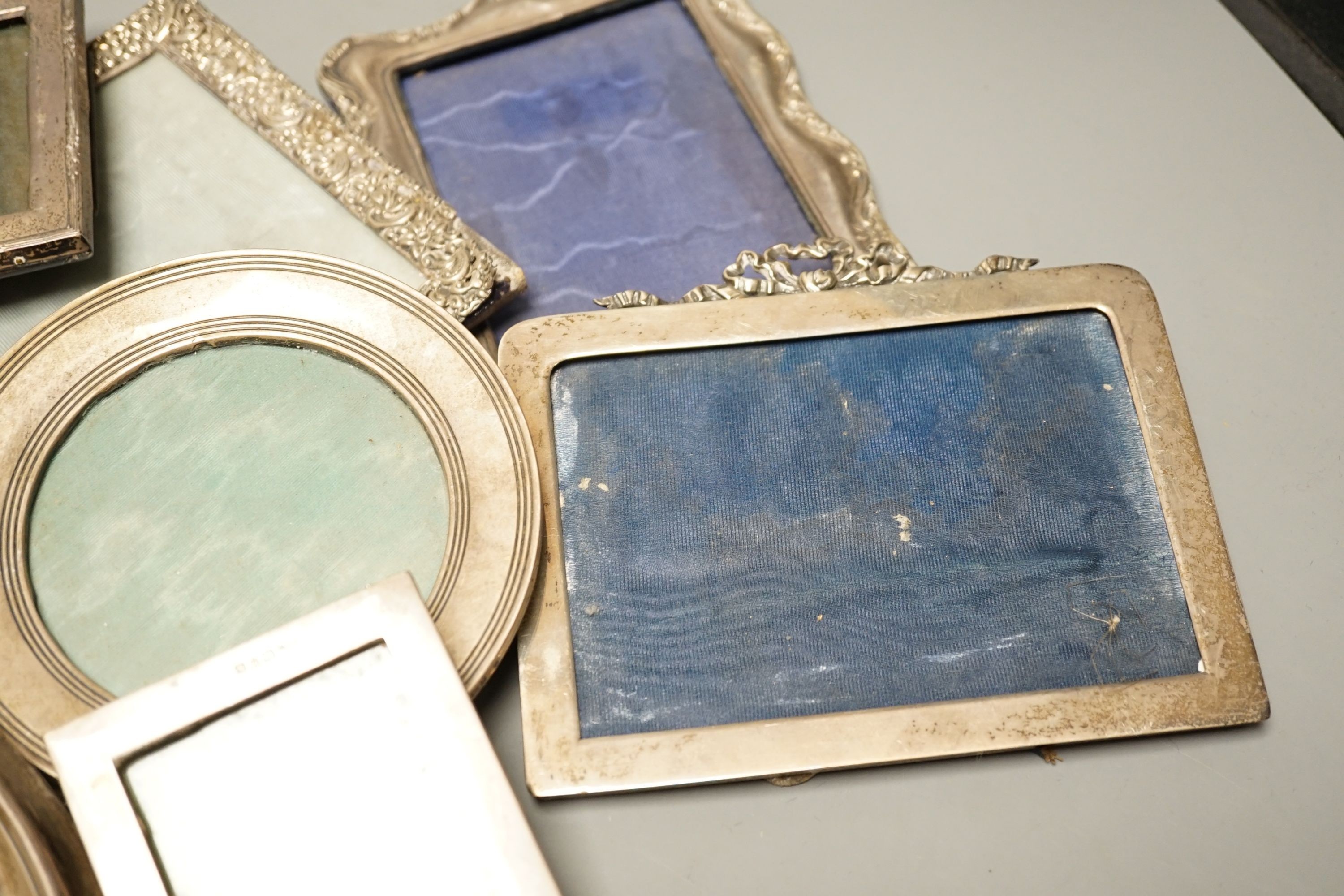 A mixed group of eight various small silver mounted photograph frames, largest 29cm and dated for Birmingham, 1911.